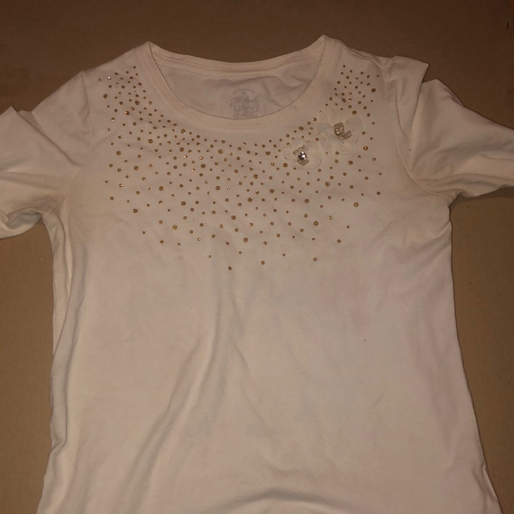 This is a cream and gold shirt